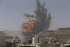 Smoke rises during an air strike on an army weapons depot on a mountain overlooking Yemen's capital Sanaa